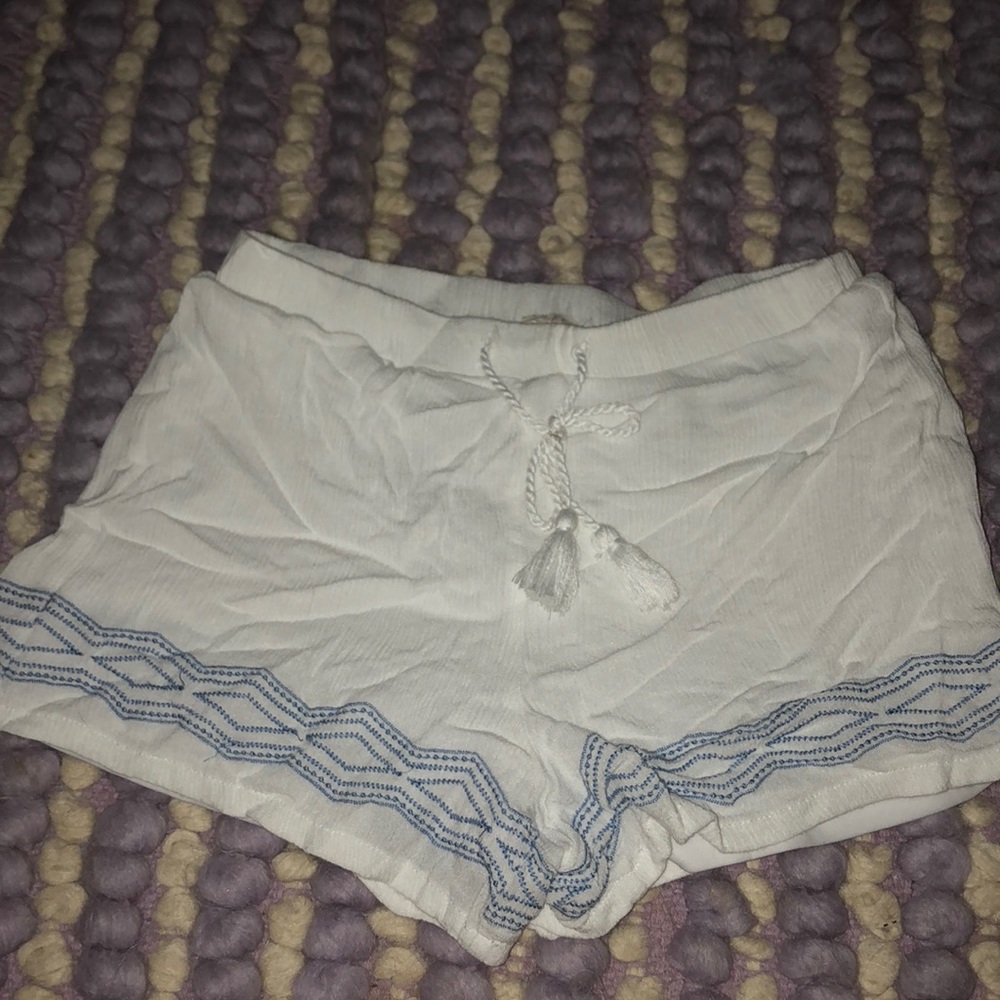 white flowy shorts with blue design and tie !!